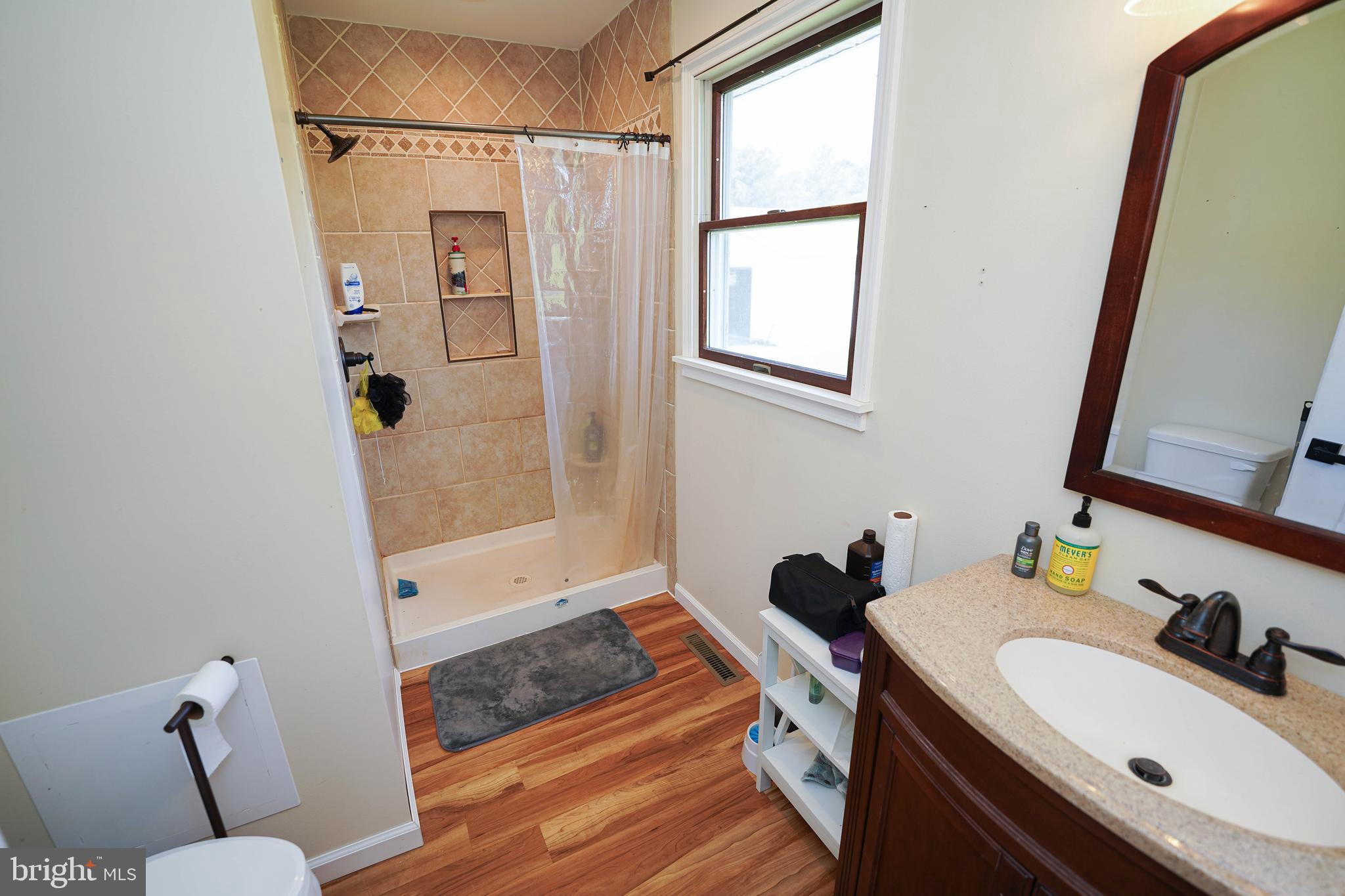 10564 Waller Road Laurel, DE 19956 - Photo 19 of 33 a bathroom with a sink and a mirror