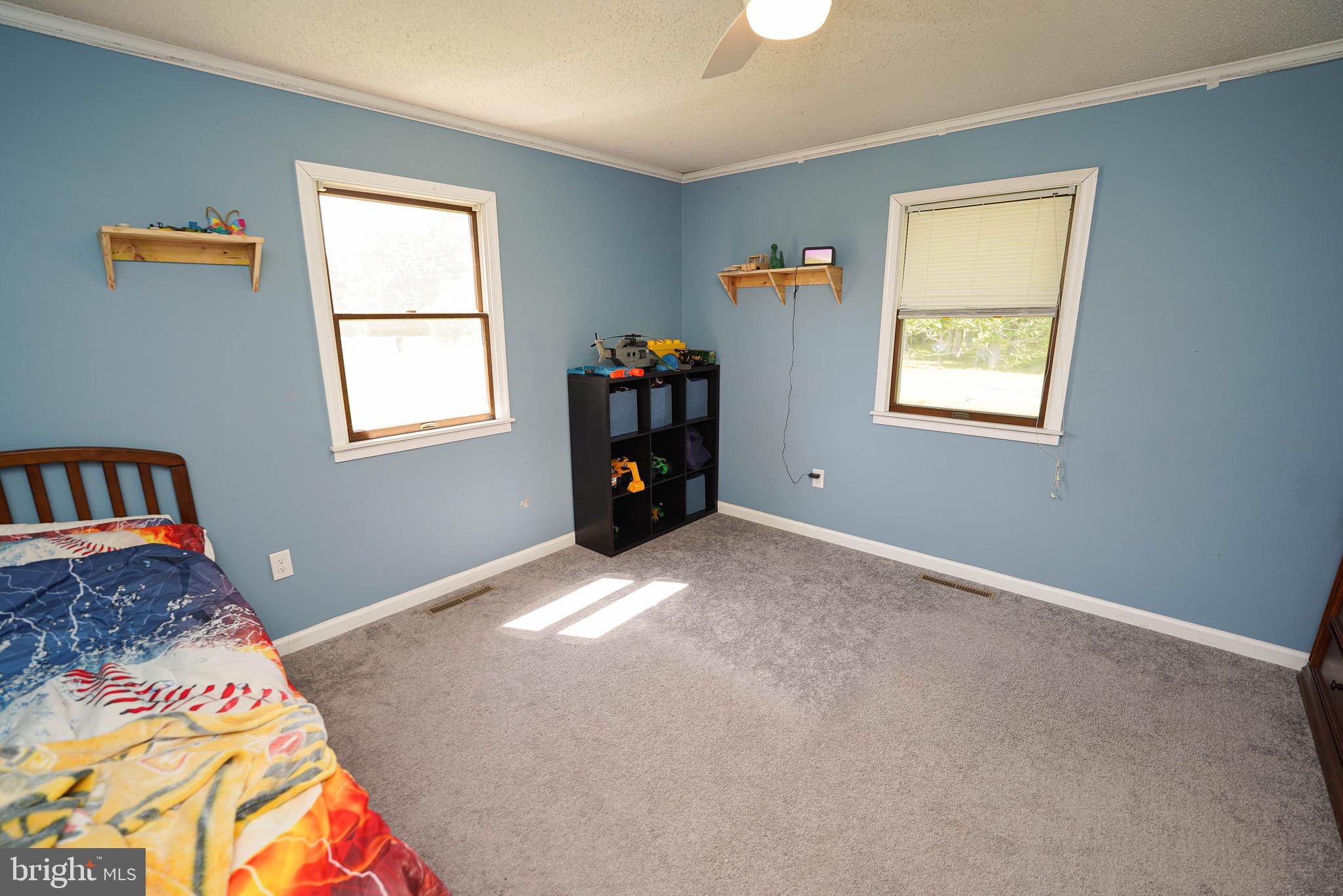 10564 Waller Road Laurel, DE 19956 - Photo 21 of 33 a bedroom with a bed and a window
