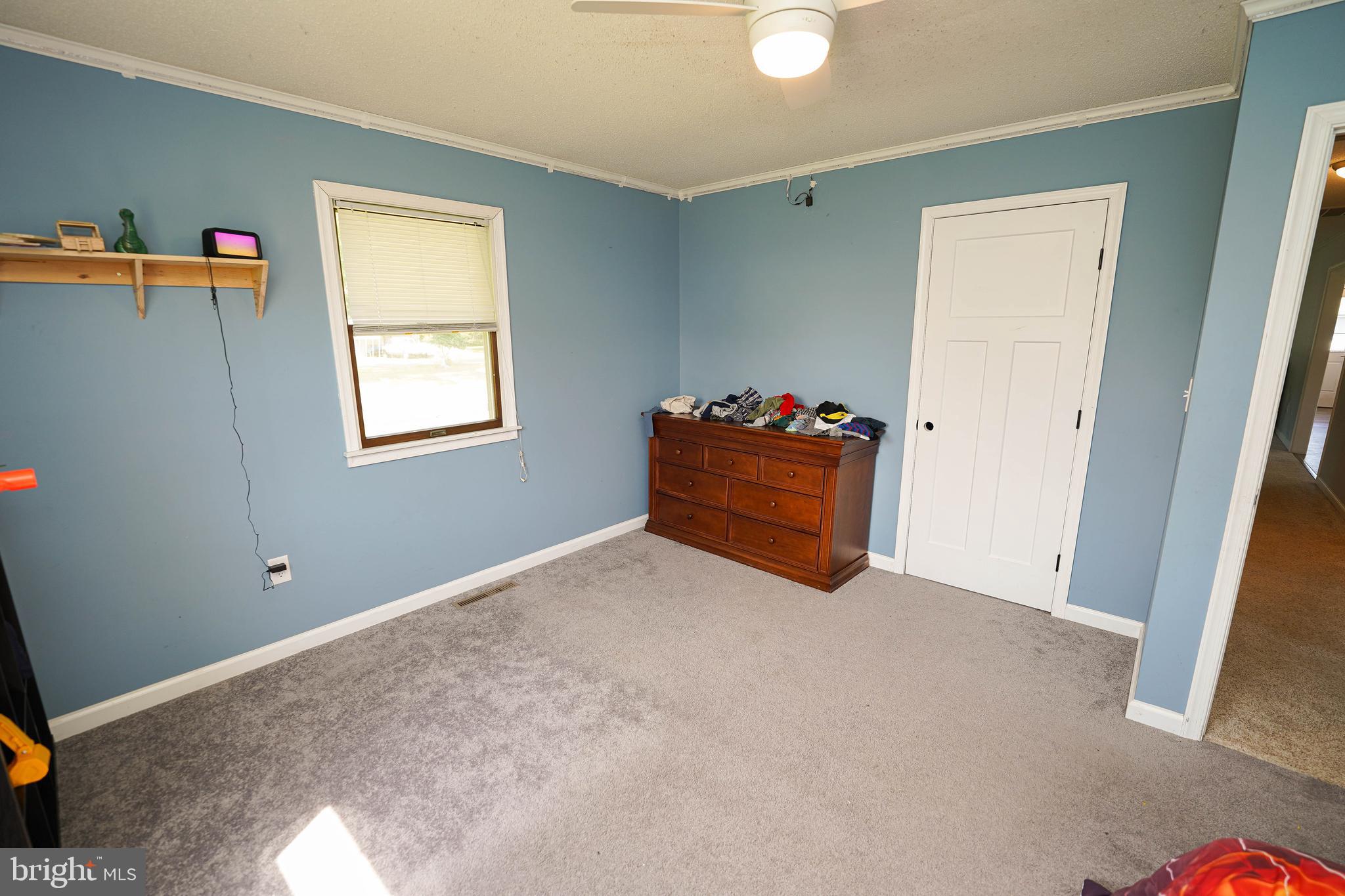 10564 Waller Road Laurel, DE 19956 - Photo 23 of 33 a room with window and dresser