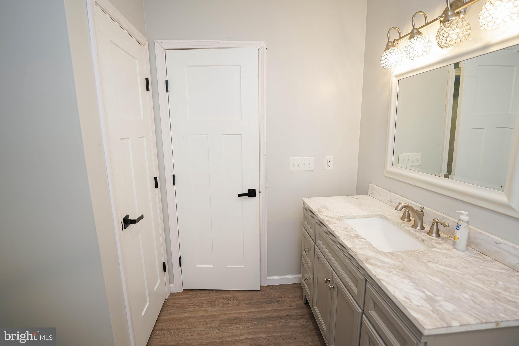 10564 Waller Road Laurel, DE 19956 - Photo 25 of 33 a bathroom with a granite countertop sink