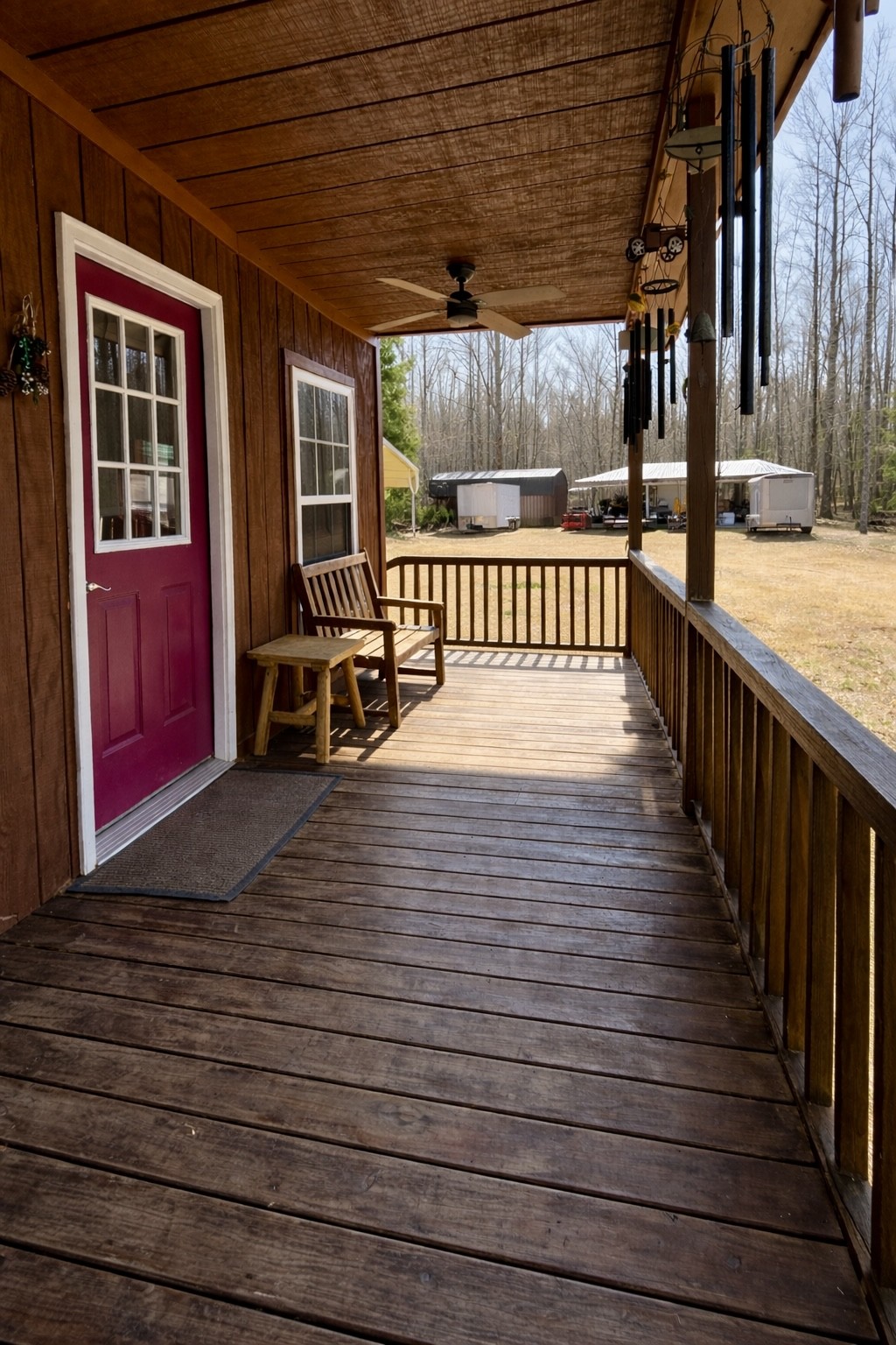 664 Russ Valley Road Lobelville, TN 37097 - Photo 22 of 63 a view of a porch with wooden floor