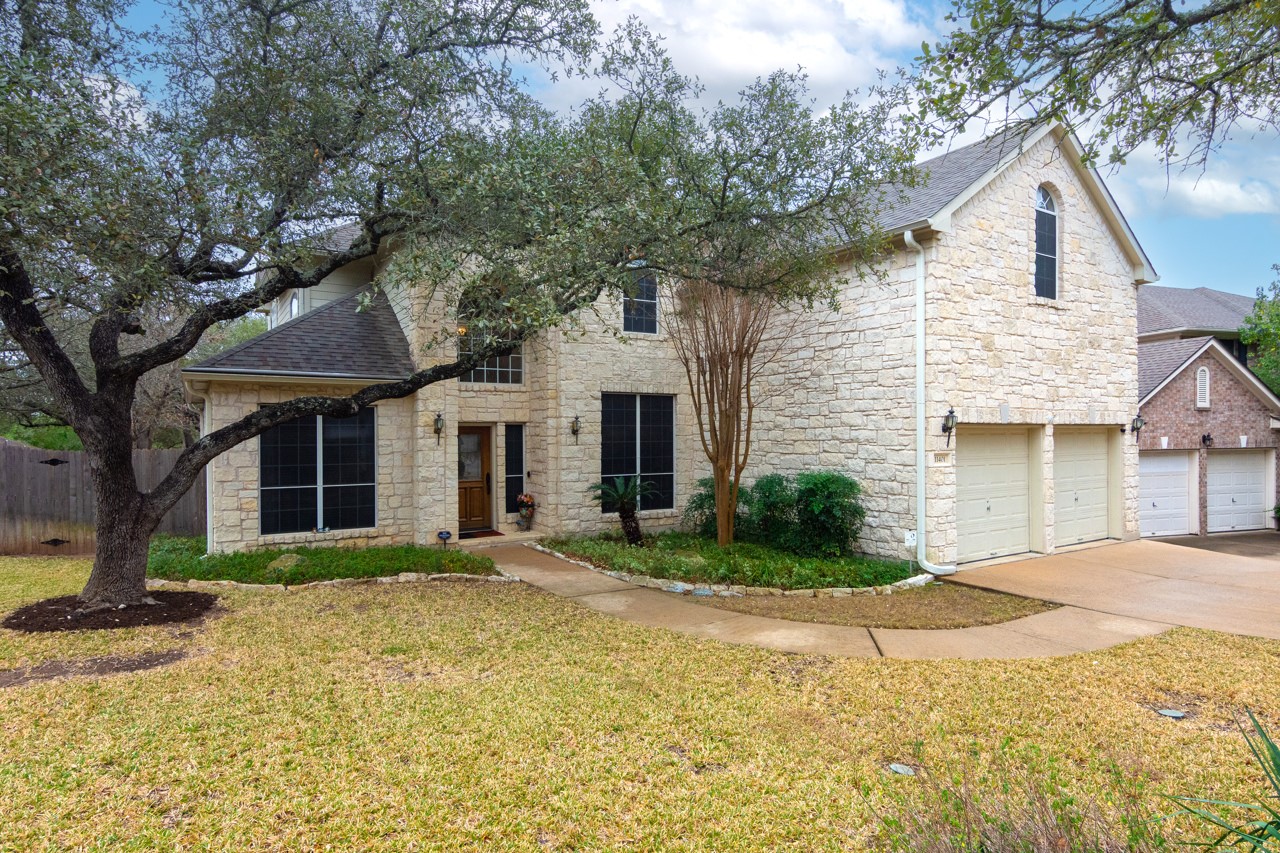 11401 Ohmfield Court Austin, TX 78739 - Photo 1 of 1 French country home featuring stone siding.