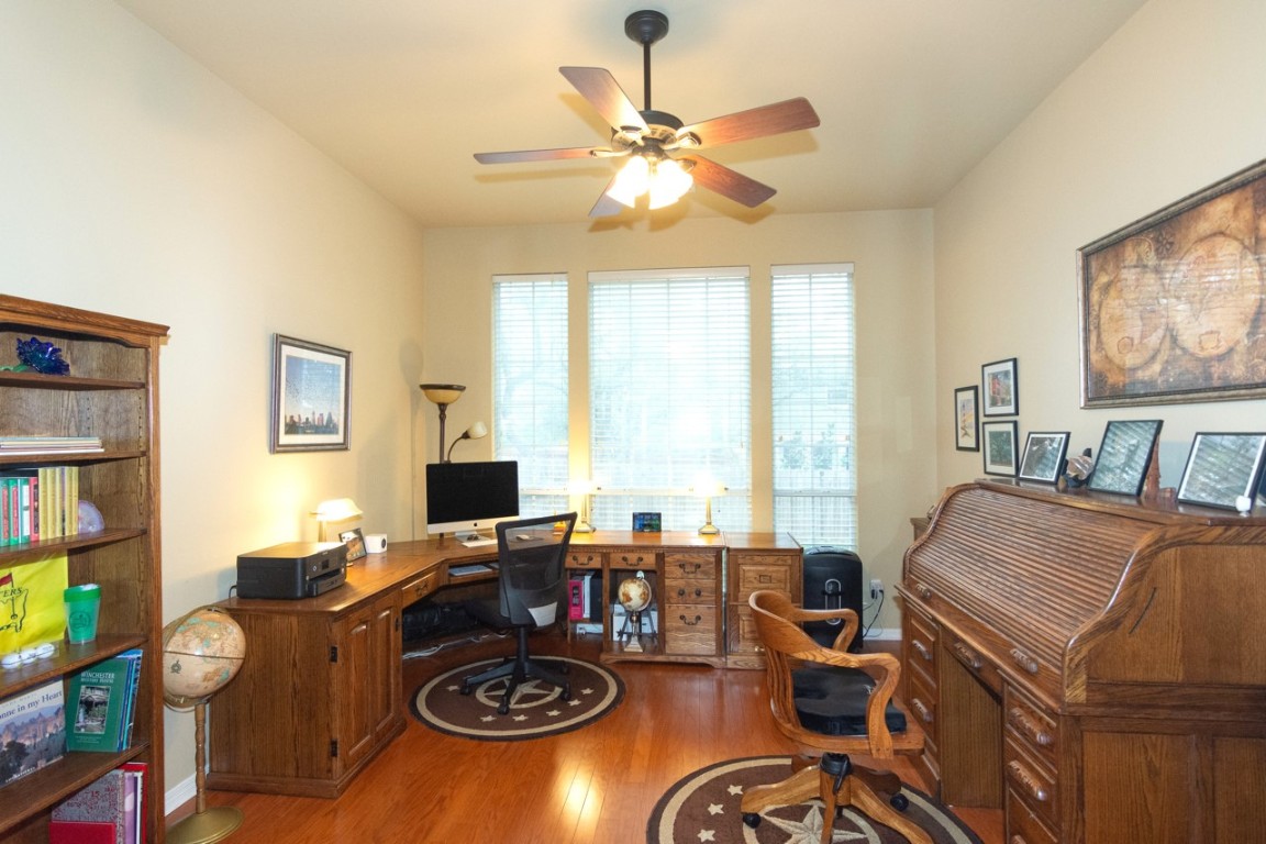 11401 Ohmfield Court Austin, TX 78739 - Photo 14 of 40 a view of a workspace with furniture and a window