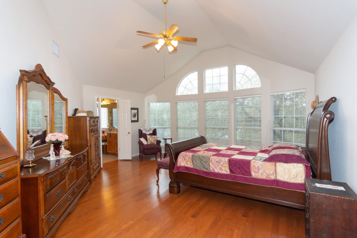 11401 Ohmfield Court Austin, TX 78739 - Photo 20 of 40 a bedroom with bed and window