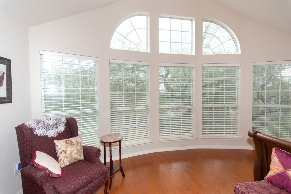 11401 Ohmfield Court Austin, TX 78739 - Photo 21 of 40 a living room with furniture and a large window