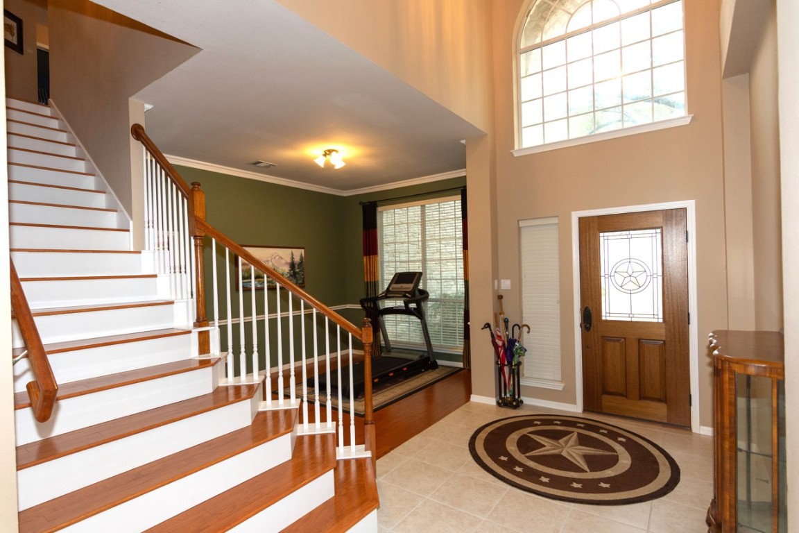 11401 Ohmfield Court Austin, TX 78739 - Photo 6 of 40 a view of a livingroom with furniture and staircase