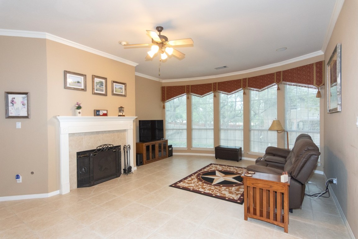11401 Ohmfield Court Austin, TX 78739 - Photo 8 of 40 a living room with furniture large window and a fireplace