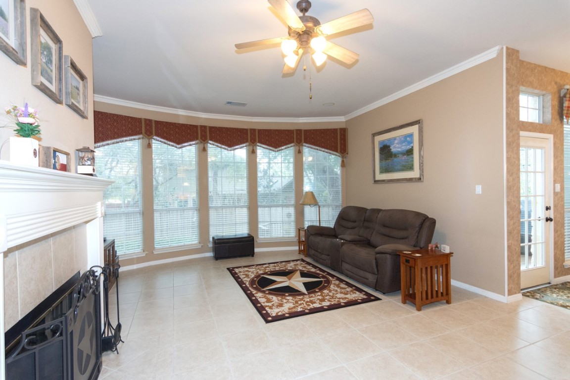 11401 Ohmfield Court Austin, TX 78739 - Photo 9 of 40 a living room with furniture and a floor to ceiling window