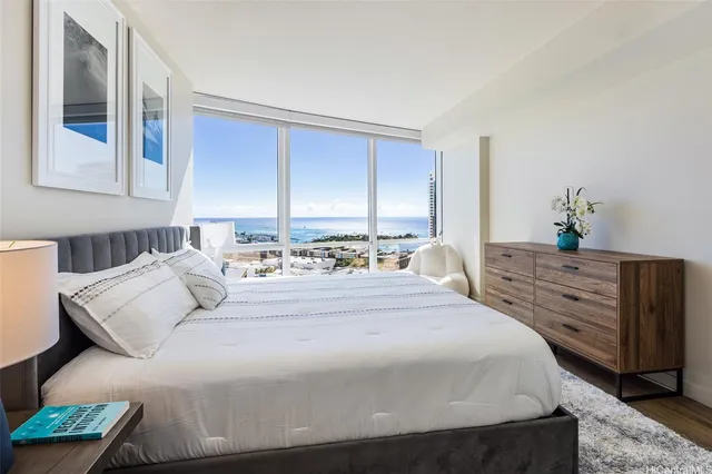 a bedroom with a bed and a dresser