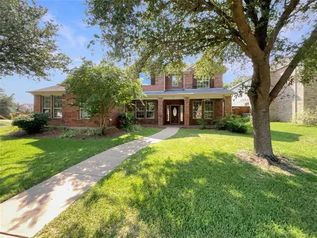 a house view with swimming pool and garden