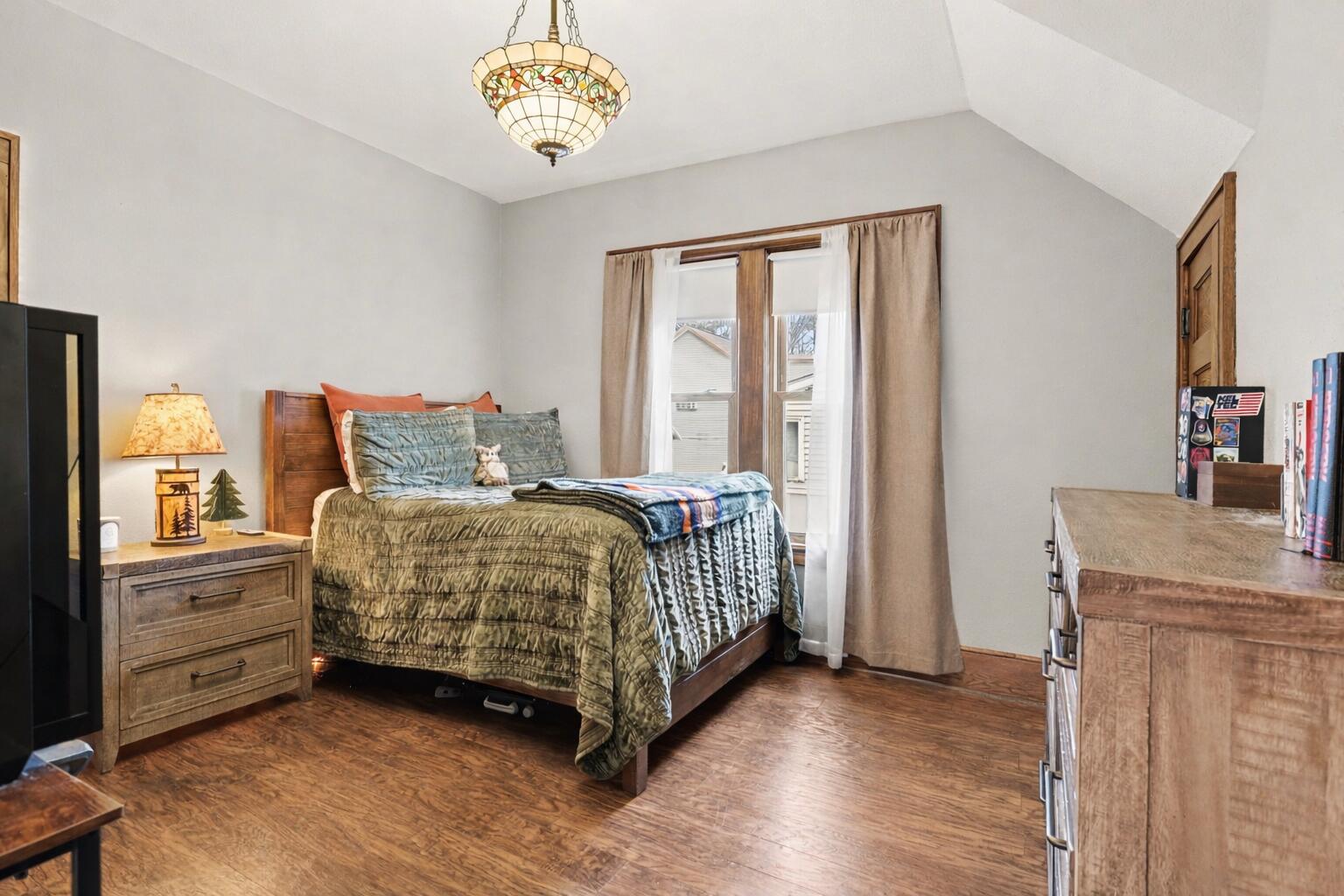 418 Rust Avenue Big Rapids, MI 49307 - Photo 6 of 31 Cozy bedroom with Tiffany chandelier