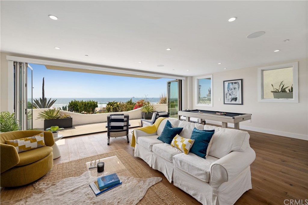 3808 The Strand Manhattan Beach, CA 90266 - Photo 23 of 67 Lower level Beach room with secondary living room, wet bar with indoor/outdoor entertaining in mind.