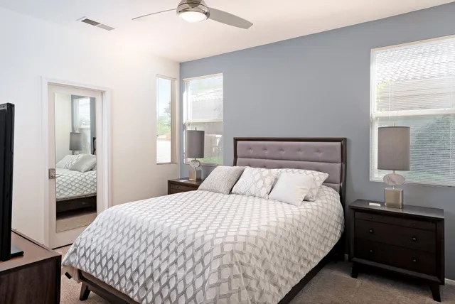 a bedroom with a bed and a window