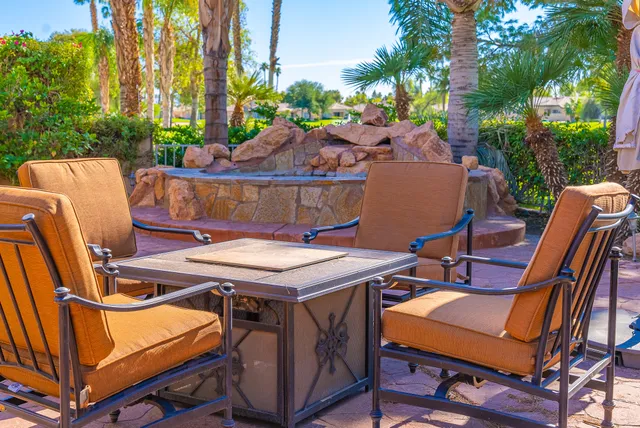 a view of a chairs and table in a patio
