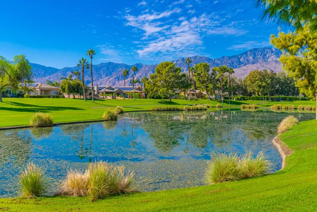 a view of a swimming pool with an outdoor space and seating area