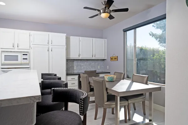 a view of a dining room with furniture window and outside view
