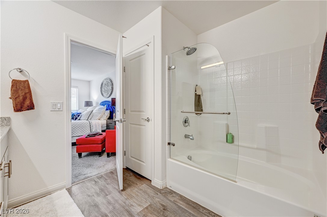 12183 Mojave Gold Road, Unit 2 Las Vegas, NV 89183 - Photo 17 of 42 Primary bathroom with upgraded frameless glass pivot tub-shower door