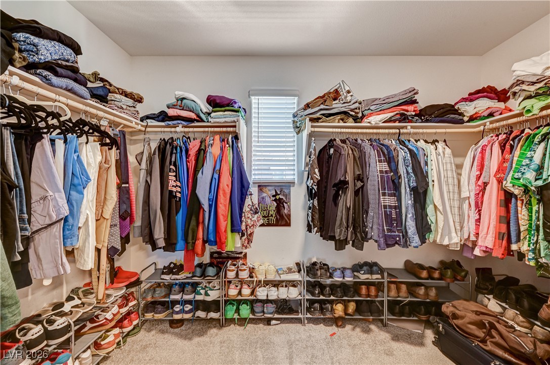 12183 Mojave Gold Road, Unit 2 Las Vegas, NV 89183 - Photo 18 of 42 Primary bedroom walk-in closet with natural light