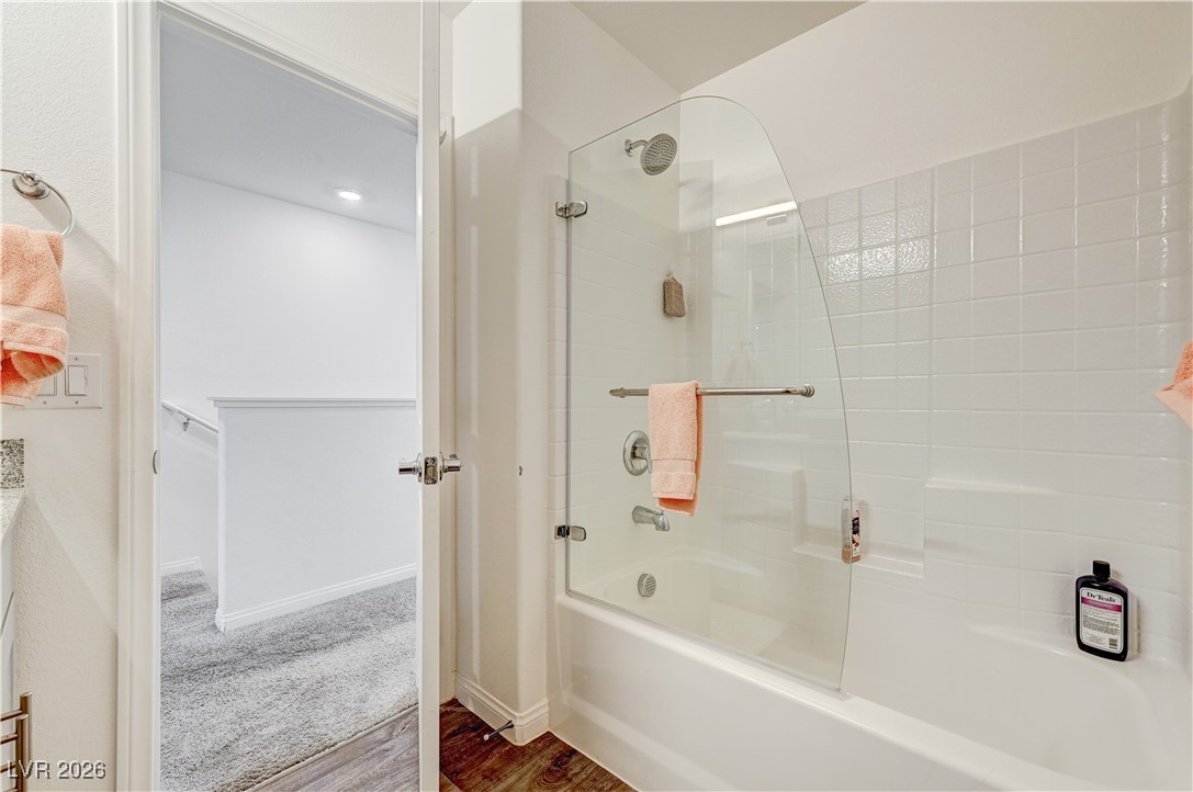 12183 Mojave Gold Road, Unit 2 Las Vegas, NV 89183 - Photo 22 of 42 Second bathroom with upgraded frameless glass pivot tub-shower door