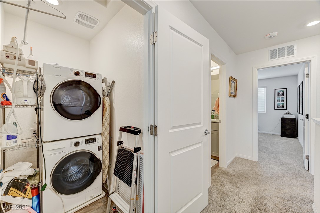 12183 Mojave Gold Road, Unit 2 Las Vegas, NV 89183 - Photo 25 of 42 Laundry closet on second floor with high efficiency Samsung electric washer and dryer