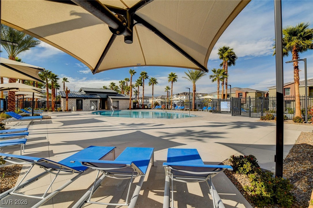 12183 Mojave Gold Road, Unit 2 Las Vegas, NV 89183 - Photo 33 of 42 Ample pool lounge chairs and sun shades