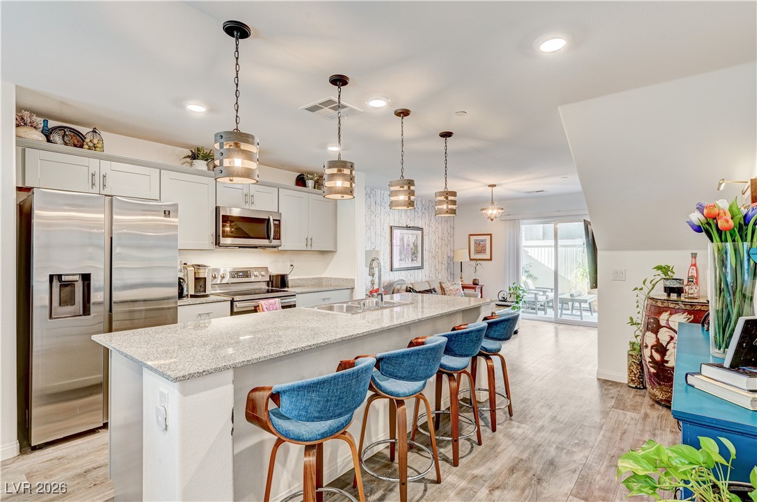 12183 Mojave Gold Road, Unit 2 Las Vegas, NV 89183 - Photo 4 of 42 Kitchen island with seating