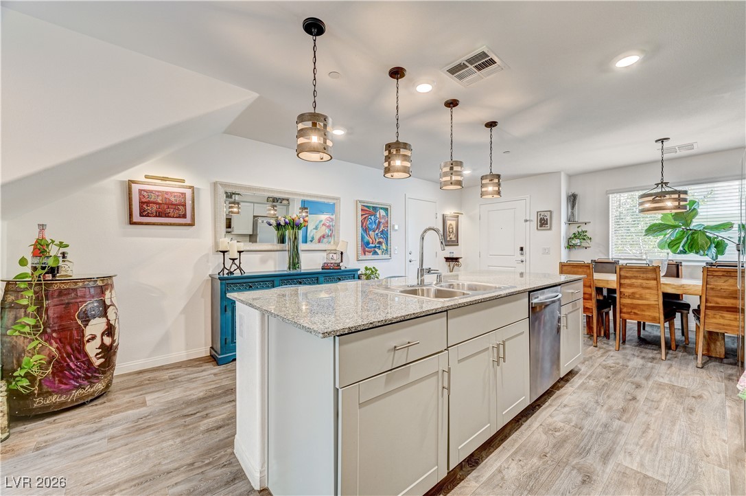 12183 Mojave Gold Road, Unit 2 Las Vegas, NV 89183 - Photo 5 of 42 Kitchen and dining area with modern light fixtures