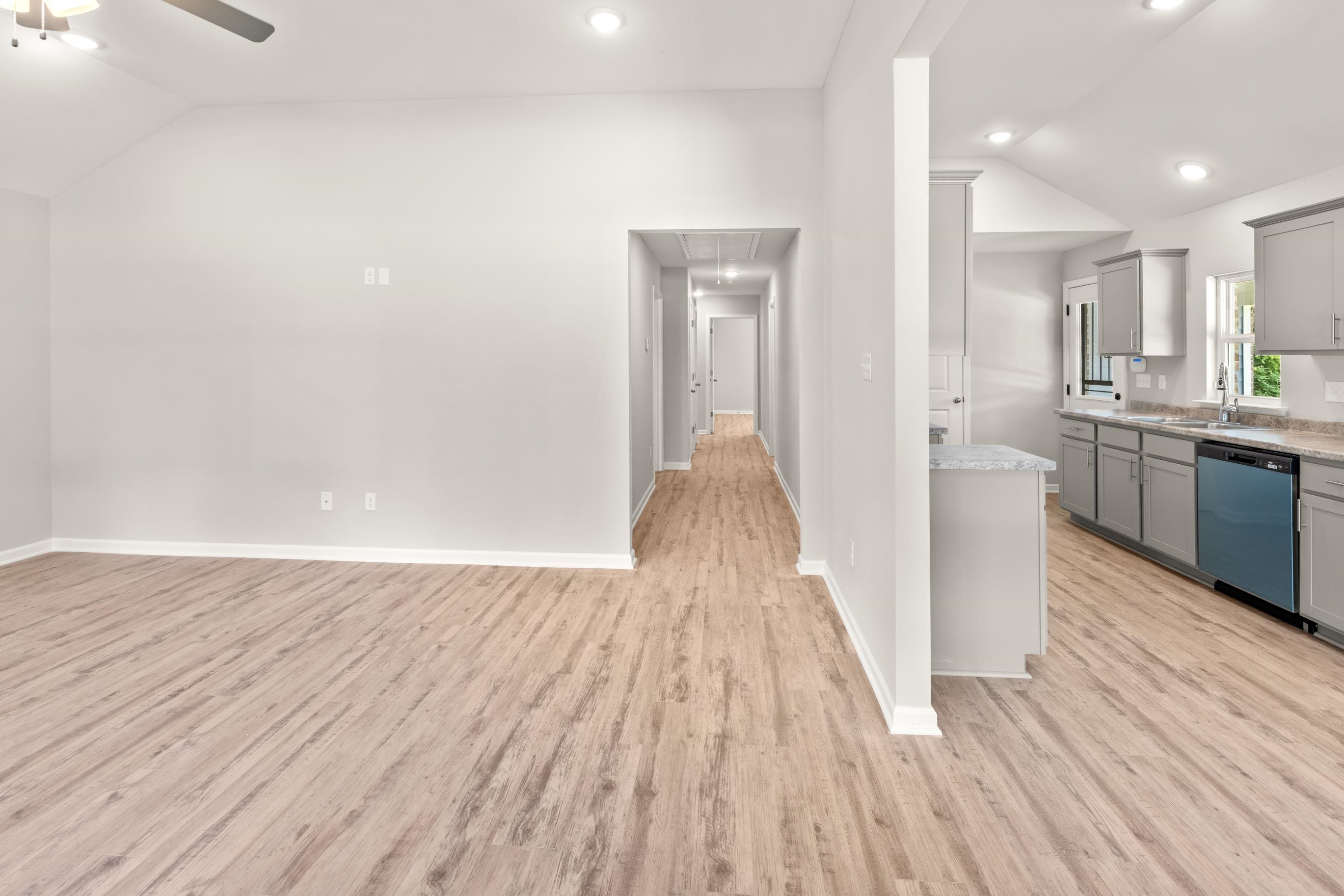 5273 Zodiac Road Memphis, TN 38118 - Photo 2 of 9 Kitchen featuring lofted ceiling, gray cabinets, light wood-type flooring, dishwashing machine, and recessed lighting