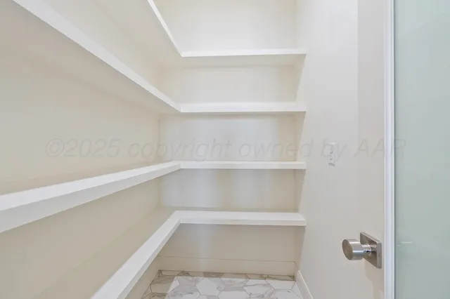 a bathroom with a shower and a sink