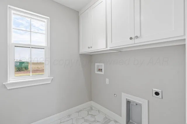 a view of walk in closet with white walls