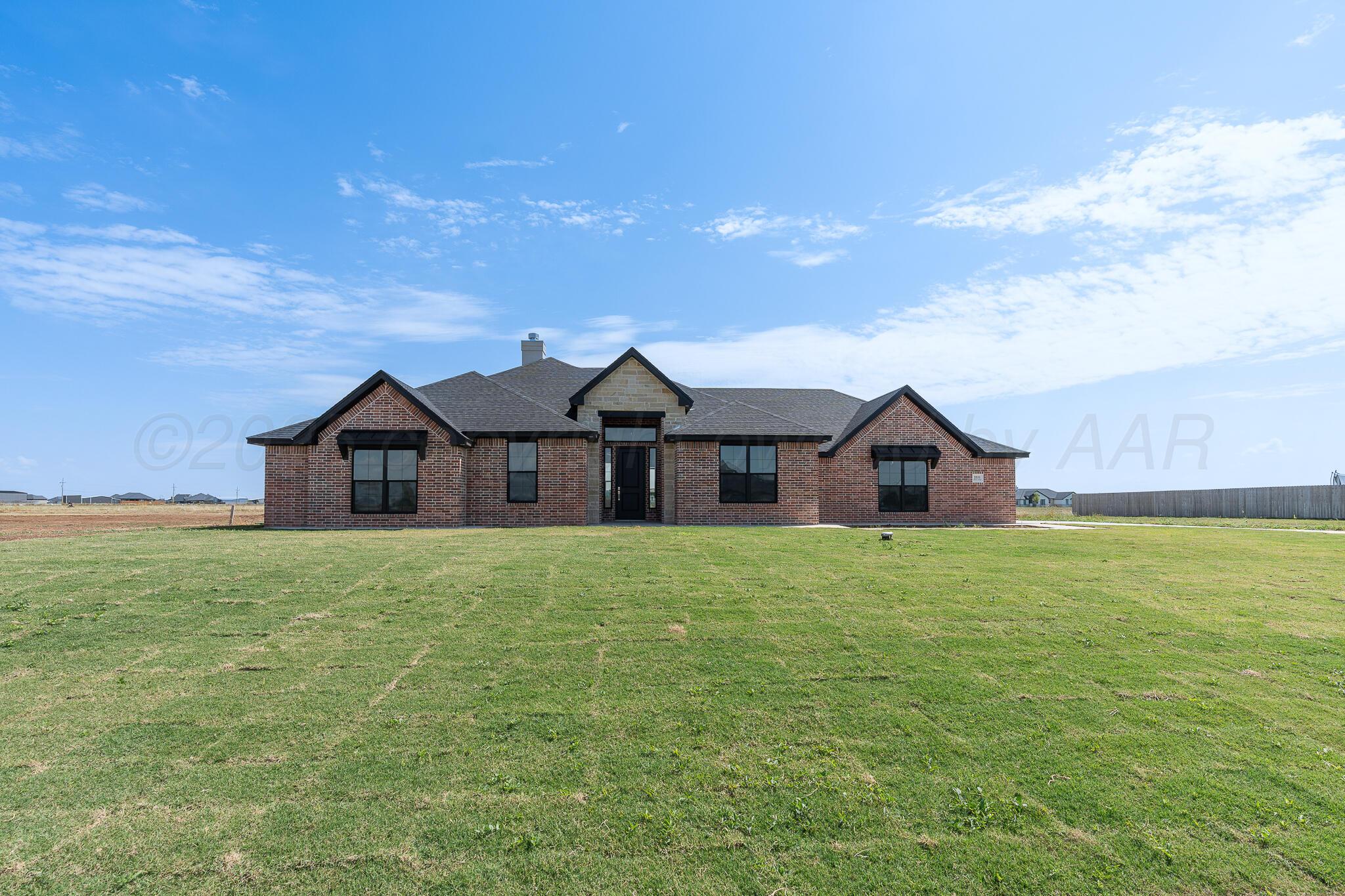 3551 Whitetail Springs Road Amarillo, TX 79119 - Photo 2 of 33 a front view of a house with a garden and yard
