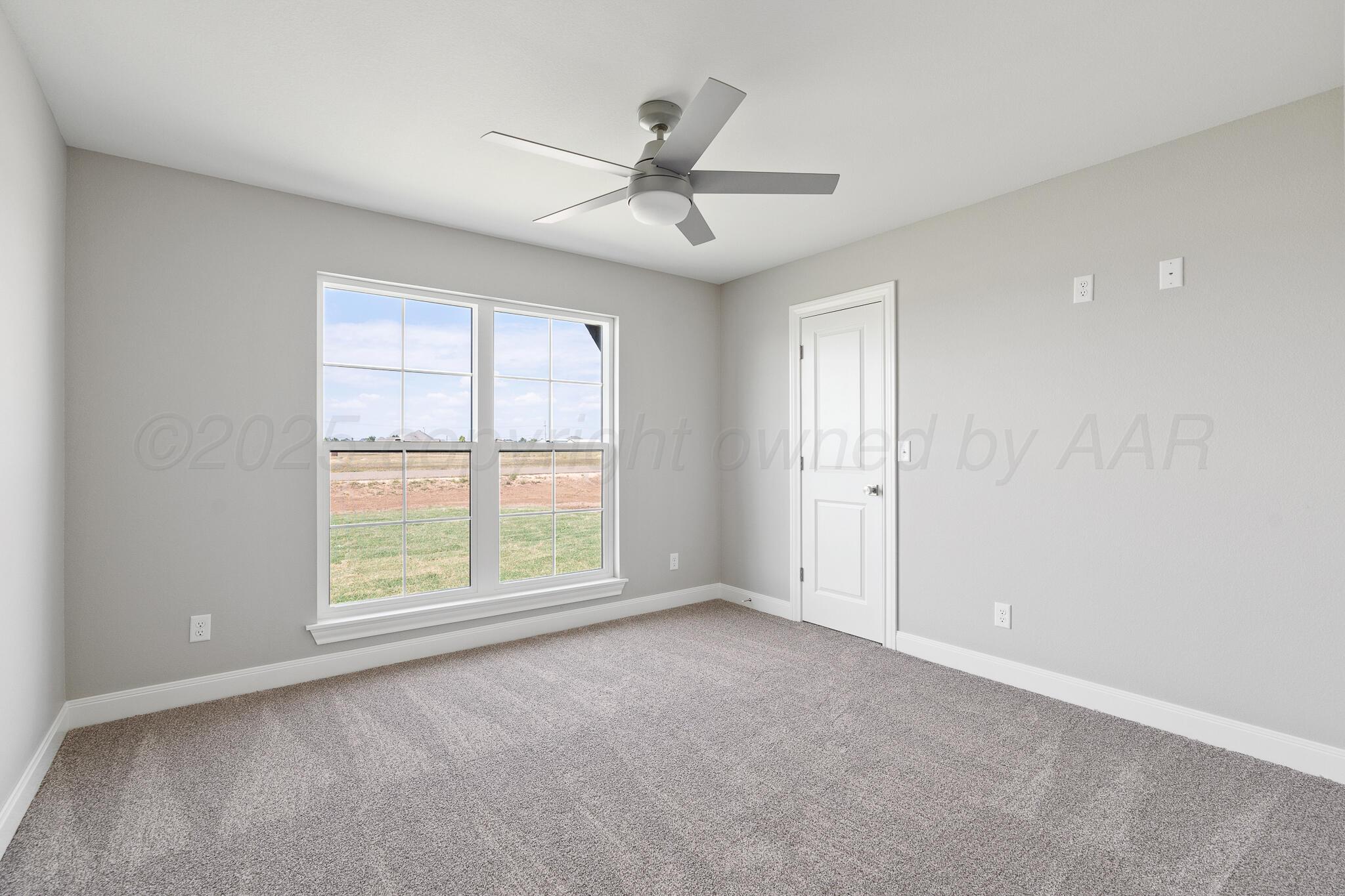 3551 Whitetail Springs Road Amarillo, TX 79119 - Photo 28 of 33 an empty room with ceiling fan and window