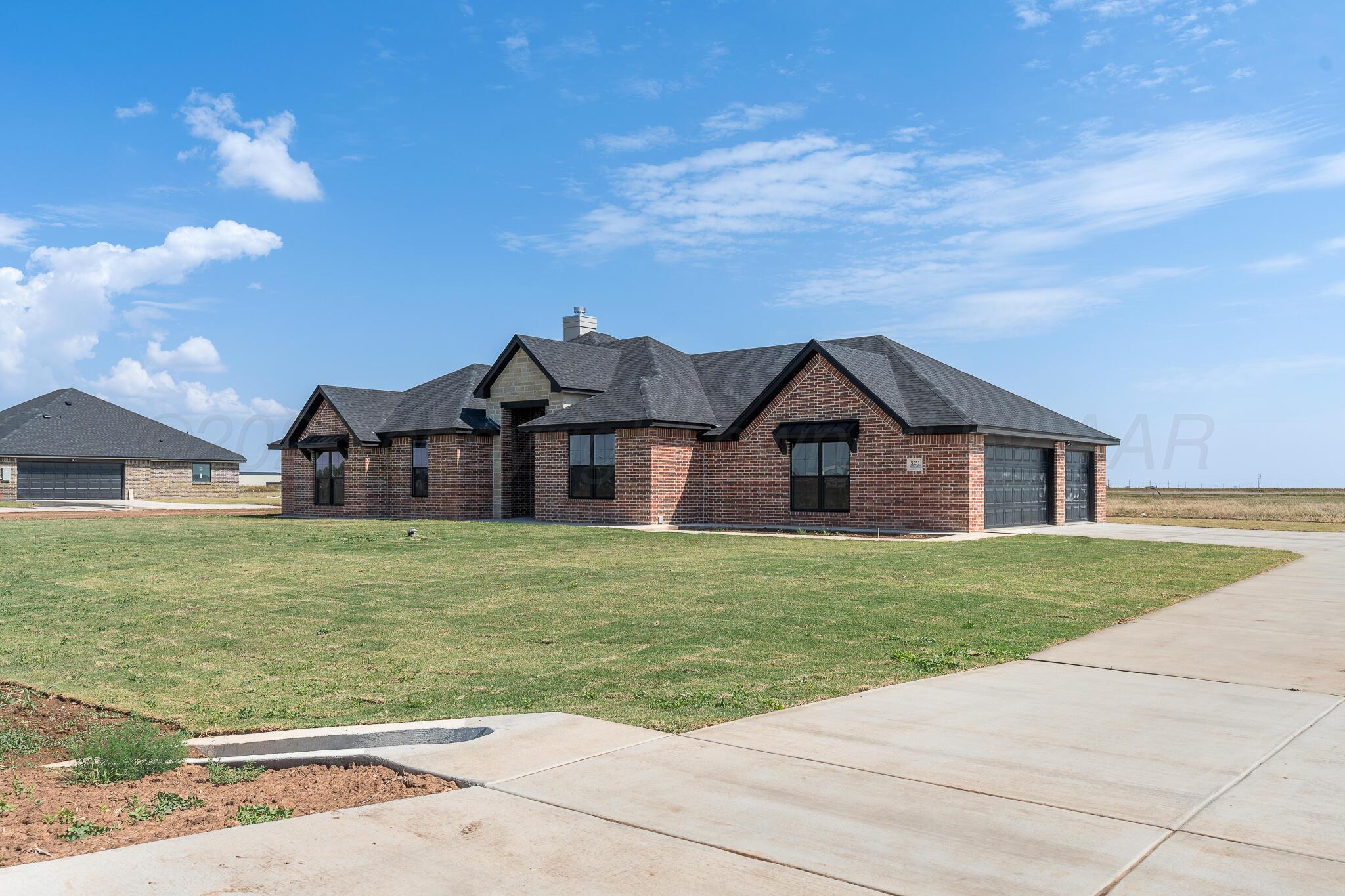 3551 Whitetail Springs Road Amarillo, TX 79119 - Photo 3 of 33 a front view of a house with garden