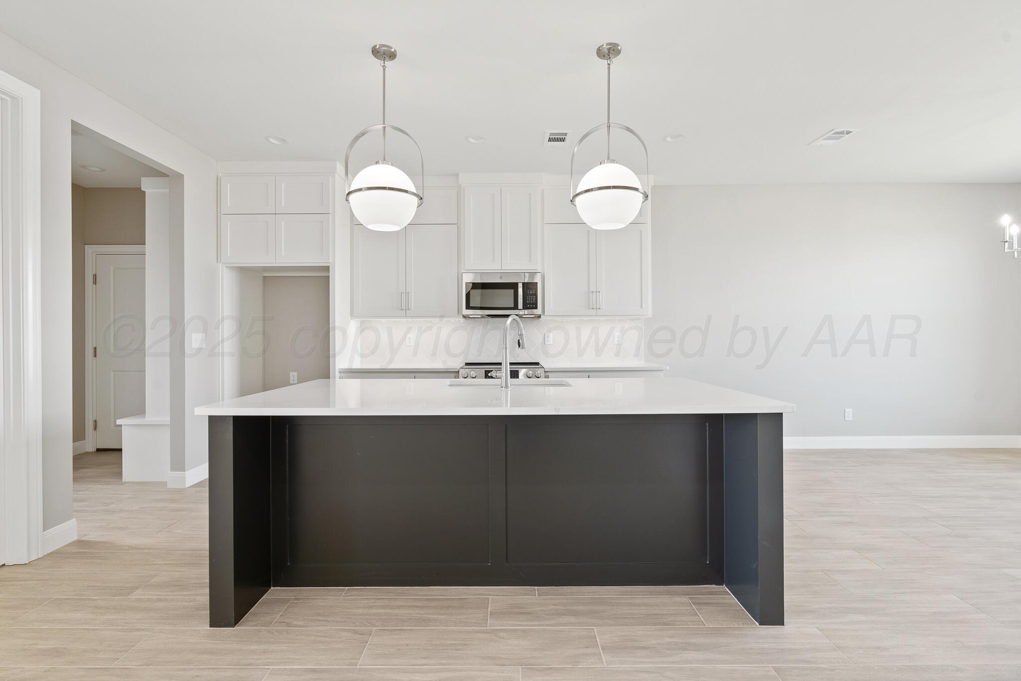 3551 Whitetail Springs Road Amarillo, TX 79119 - Photo 7 of 33 a bathroom with a sink and a mirror