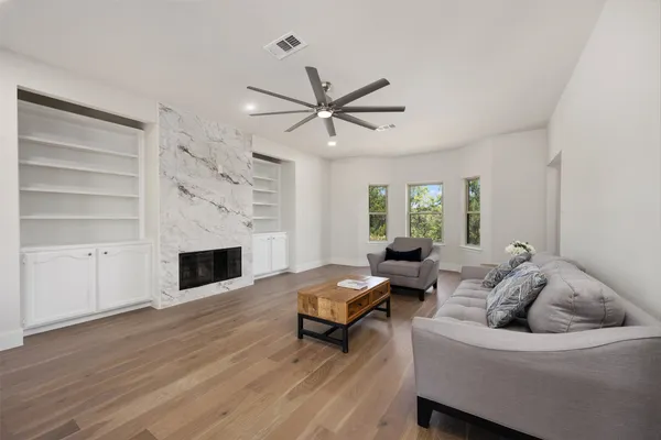 a living room with furniture and a fireplace