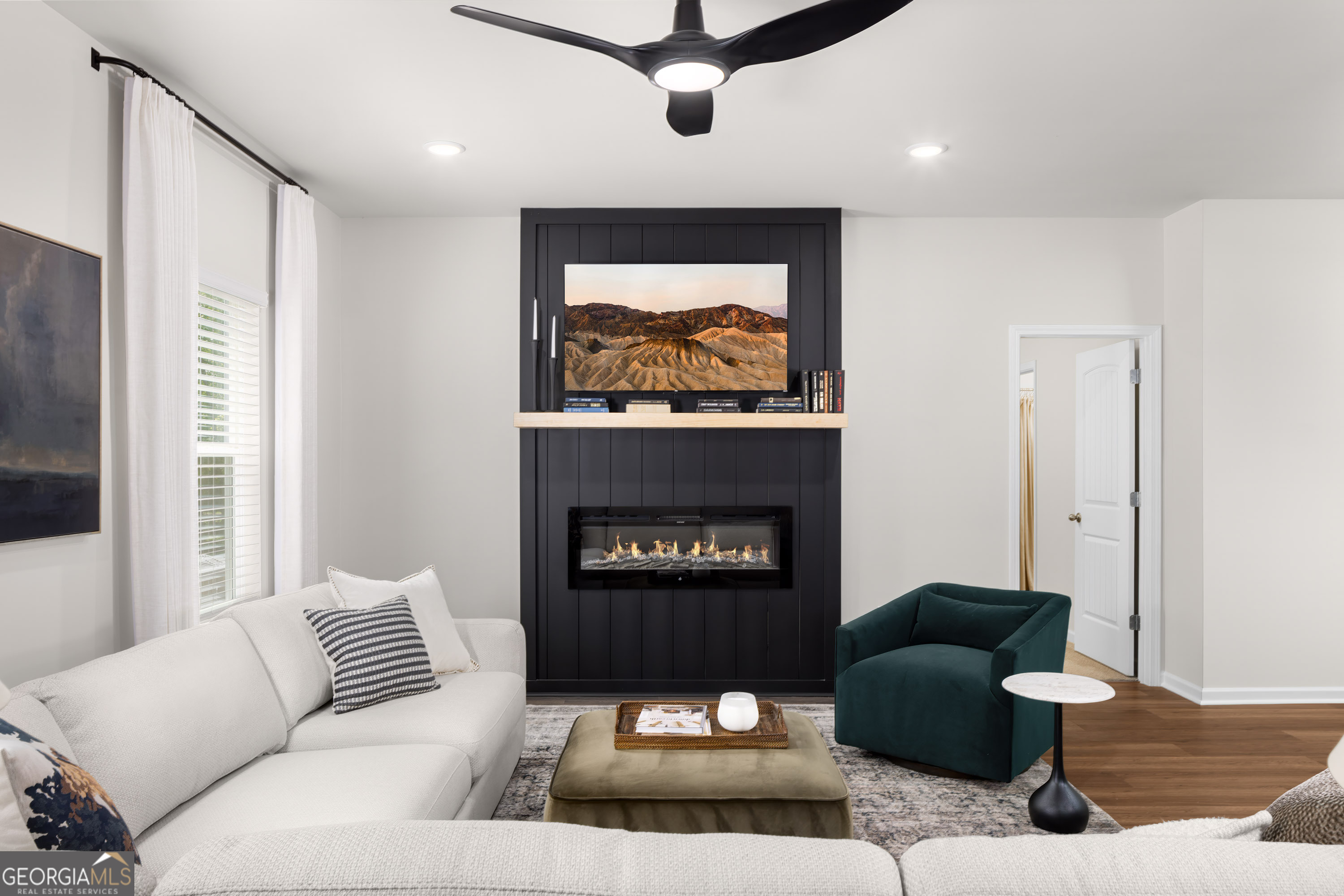 129 Southeast Honey Creek Road, Unit 4 Conyers, GA 30094 - Photo 18 of 21 a living room with furniture and a fireplace