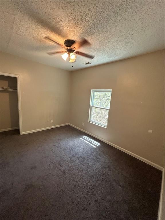 1182 Sims Street Southwest Atlanta, GA 30310 - Photo 17 of 35 an empty room with windows and fan