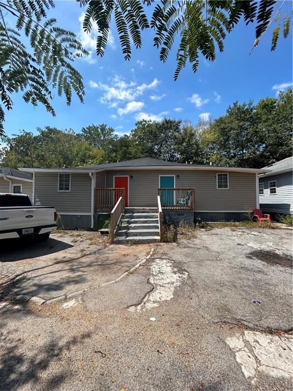 1182 Sims Street Southwest Atlanta, GA 30310 - Photo 2 of 35 a view of a house with a yard and a tree
