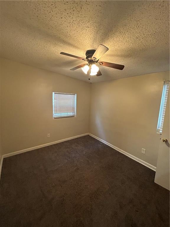 1182 Sims Street Southwest Atlanta, GA 30310 - Photo 26 of 35 an empty room with a window and a fan