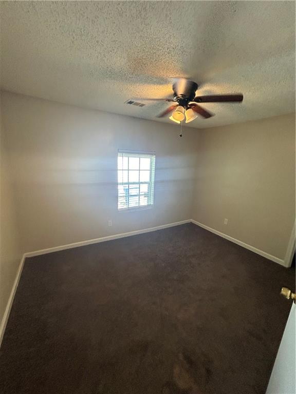 1182 Sims Street Southwest Atlanta, GA 30310 - Photo 33 of 35 an empty room with a window and a fan