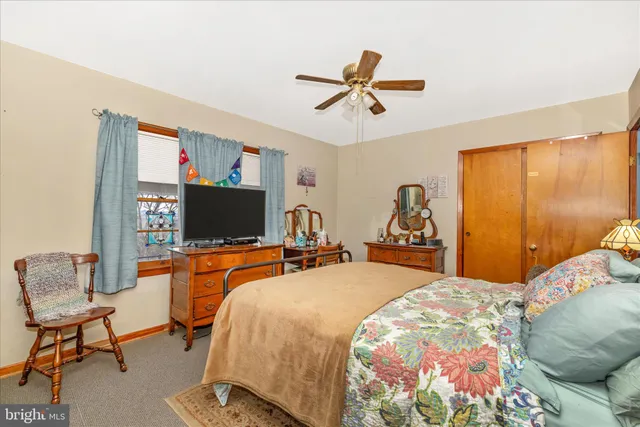 a bed room with a bed furniture and a window