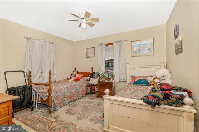 a bedroom with furniture and a flat screen tv