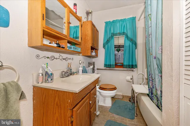 a view of a bathroom from a hallway