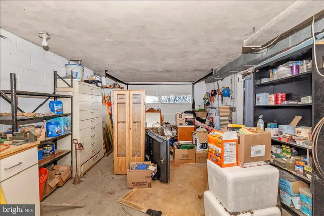 a view of a house with snow on the side of the road