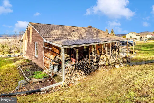a view of a patio with a table and chairs