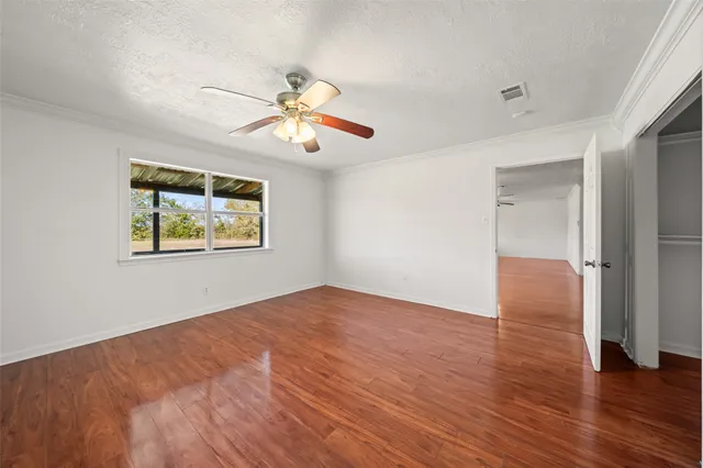 a view of a kitchen with a sink and a window