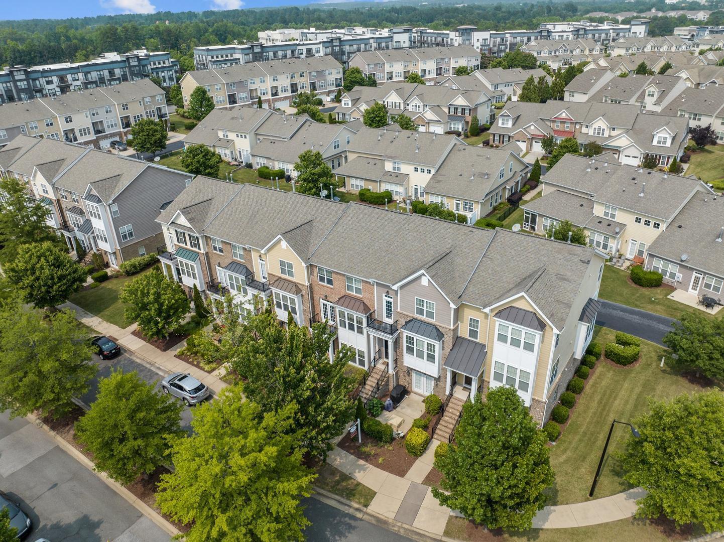 an aerial view of residential houses with outdoor space