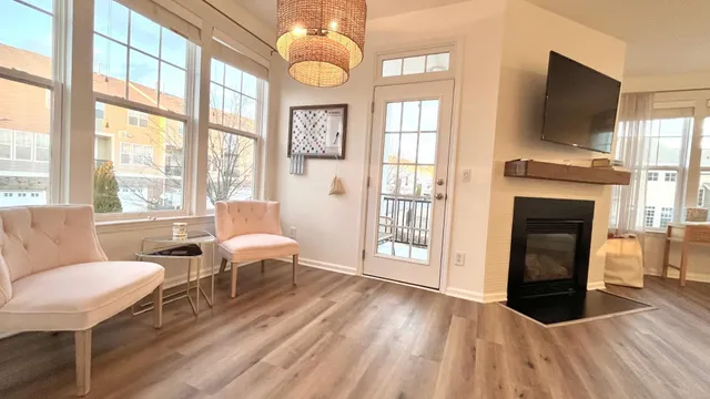 a living room with fireplace furniture and a flat screen tv