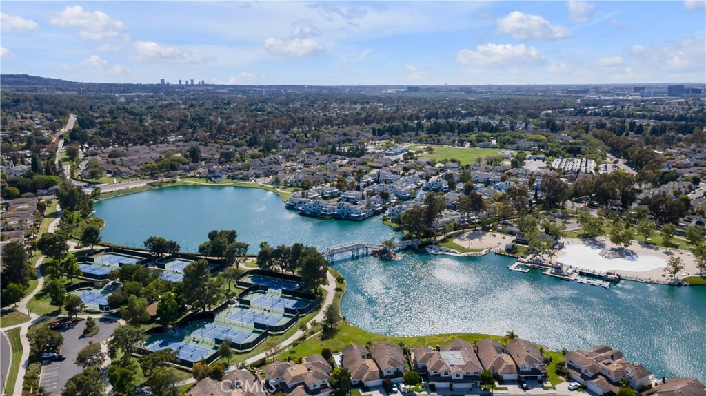 336 Fallingstar Irvine, CA 92614 - Photo 65 of 73 an aerial view of a city with lots of residential buildings ocean and mountain view in back
