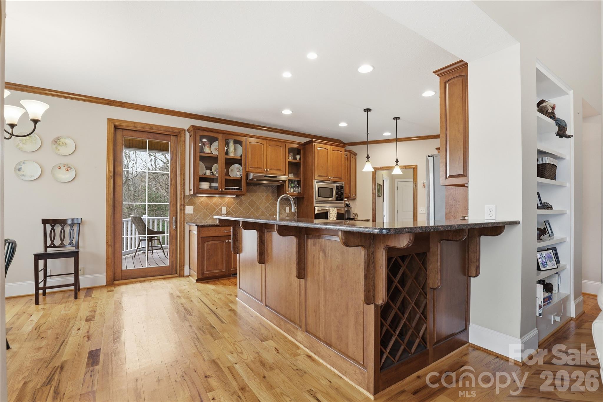 1084 Rocky Headwaters Road Moravian Falls, NC 28654 - Photo 11 of 43 a view of kitchen with furniture and wooden floor